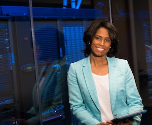 person smiling in server room